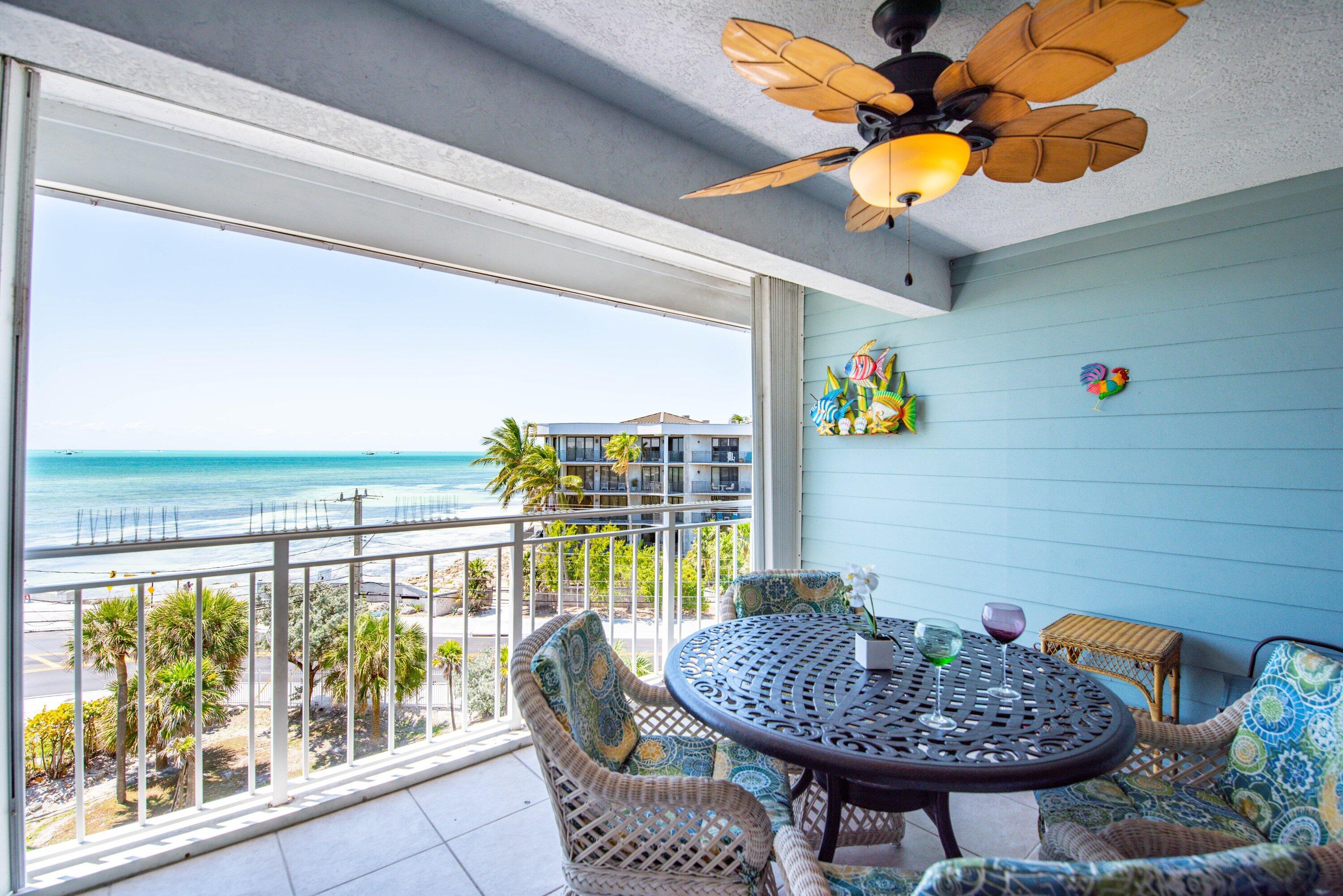 1901 South Roosevelt Boulevard, Unit 404S Key West, FL 33040 - Photo 20 of 39 a dining room with furniture and outdoor view
