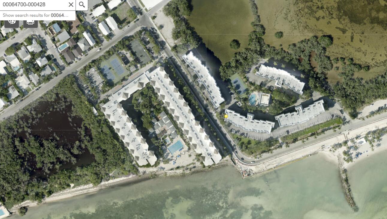 1901 South Roosevelt Boulevard, Unit 404S Key West, FL 33040 - Photo 35 of 39 an aerial view of a house with a yard