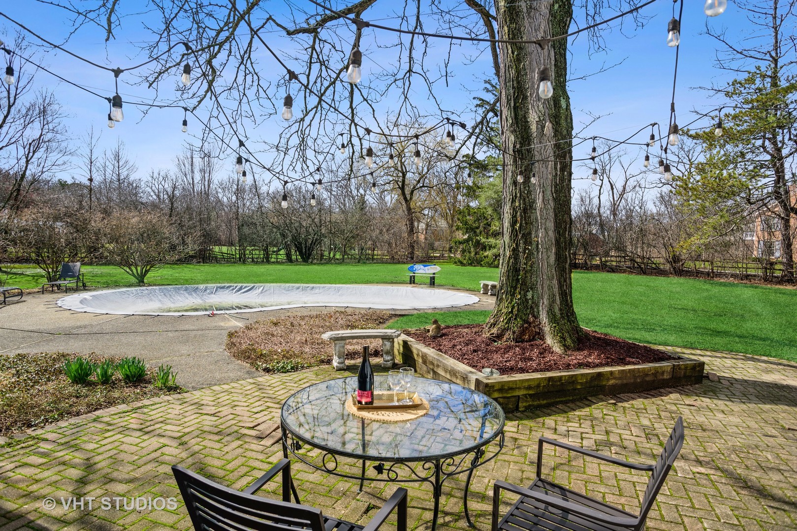 2110 Middlefork Road Northfield, IL 60093 - Photo 31 of 34 a view of a backyard with table and chairs potted plants and tree