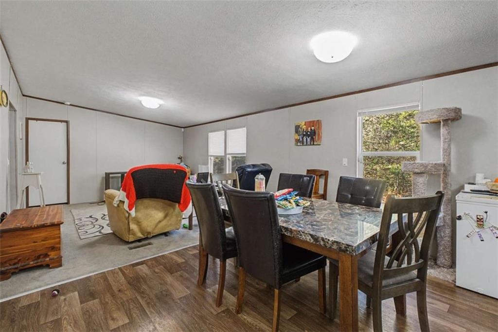 1343 Prior Station Road Cedartown, GA 30125 - Photo 14 of 39 a view of a dining room with furniture and wooden floor