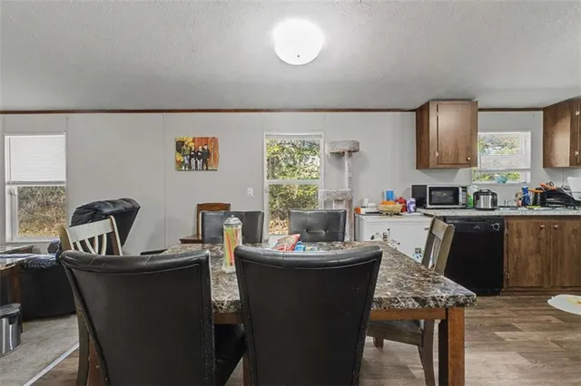 a dining room with furniture and window