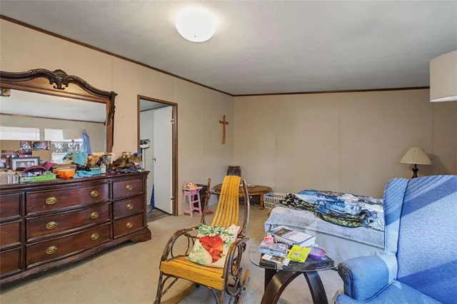 a room with a baby crib and a dresser