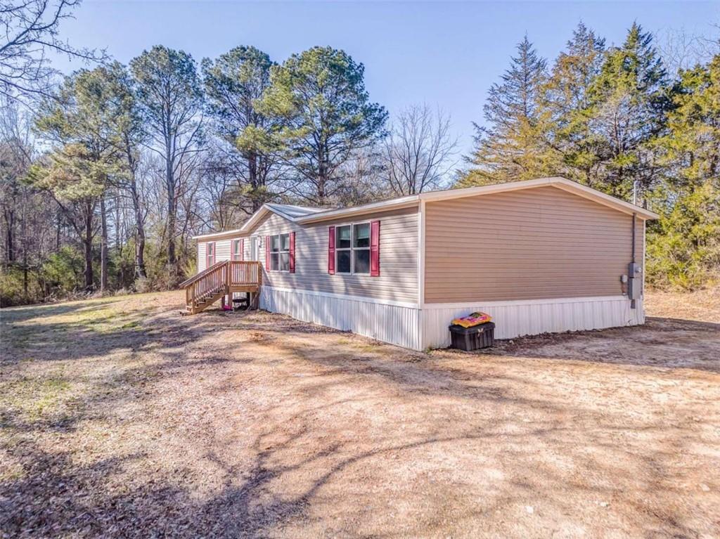 1343 Prior Station Road Cedartown, GA 30125 - Photo 36 of 39 a view of a house with a snow in the yard