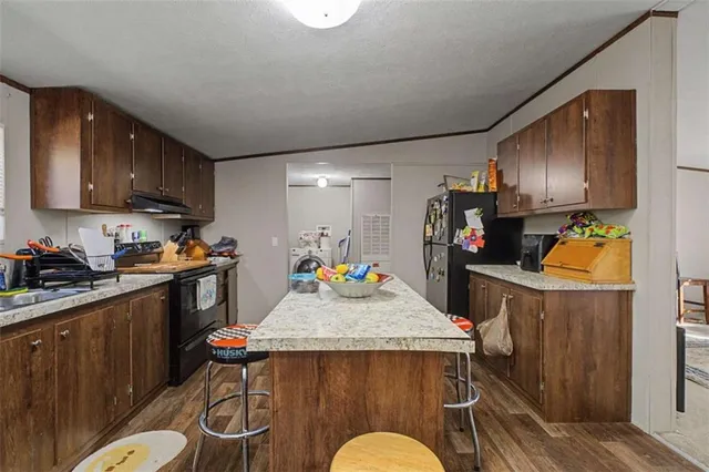 a kitchen with sink cabinets and appliances