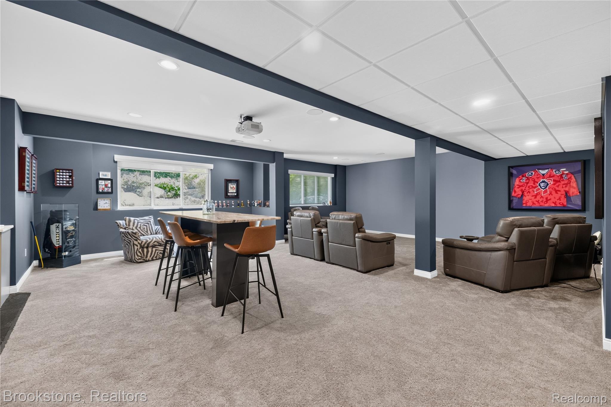 2167 Sanctuary Court Rochester, MI 48309 - Photo 25 of 68 Spacious recreational room featuring gray carpeting, recessed lighting, and multiple windows providing natural illumination