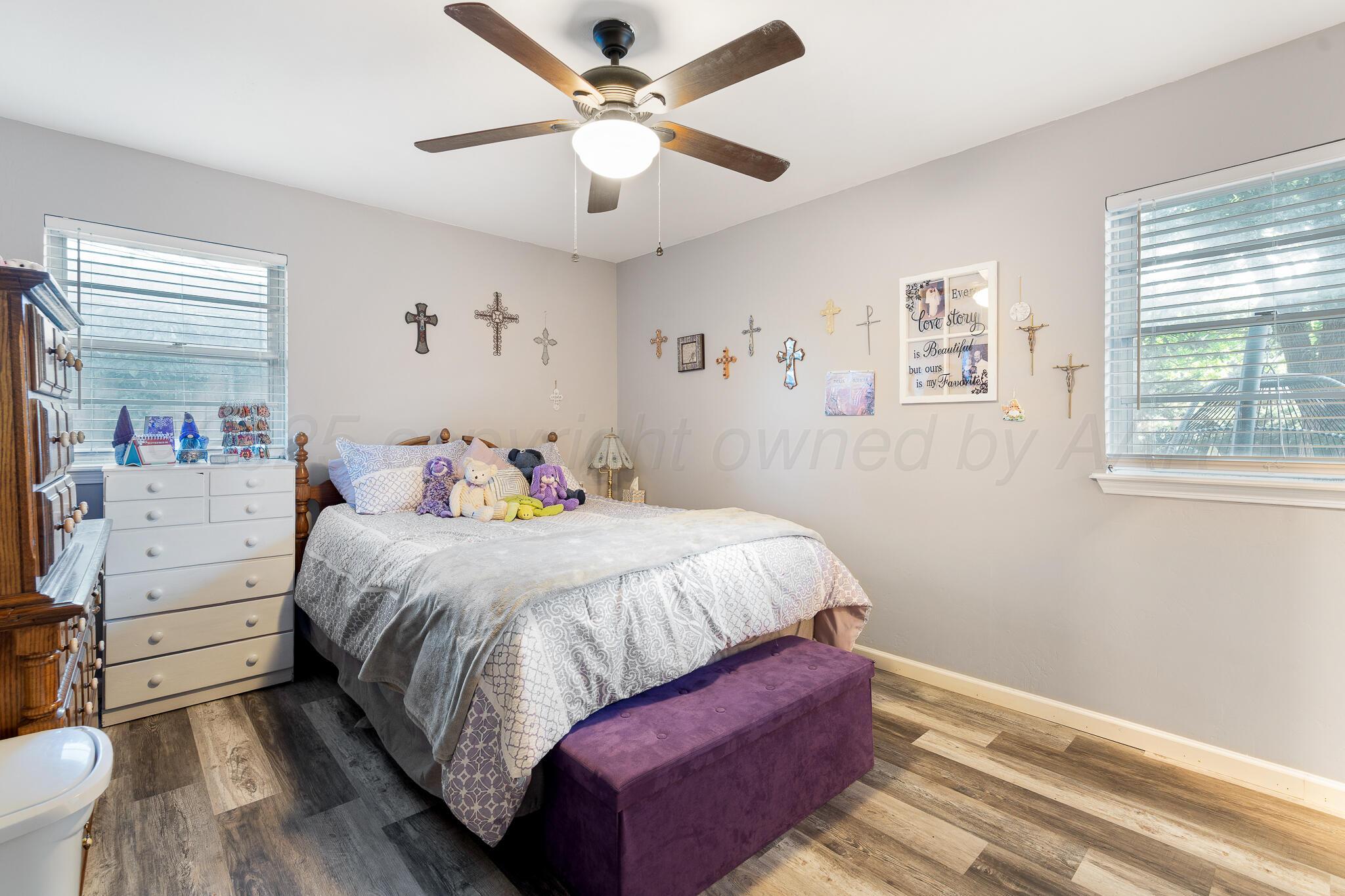 4307 Harmony Street Amarillo, TX 79109 - Photo 13 of 25 a bedroom with a large bed and a window