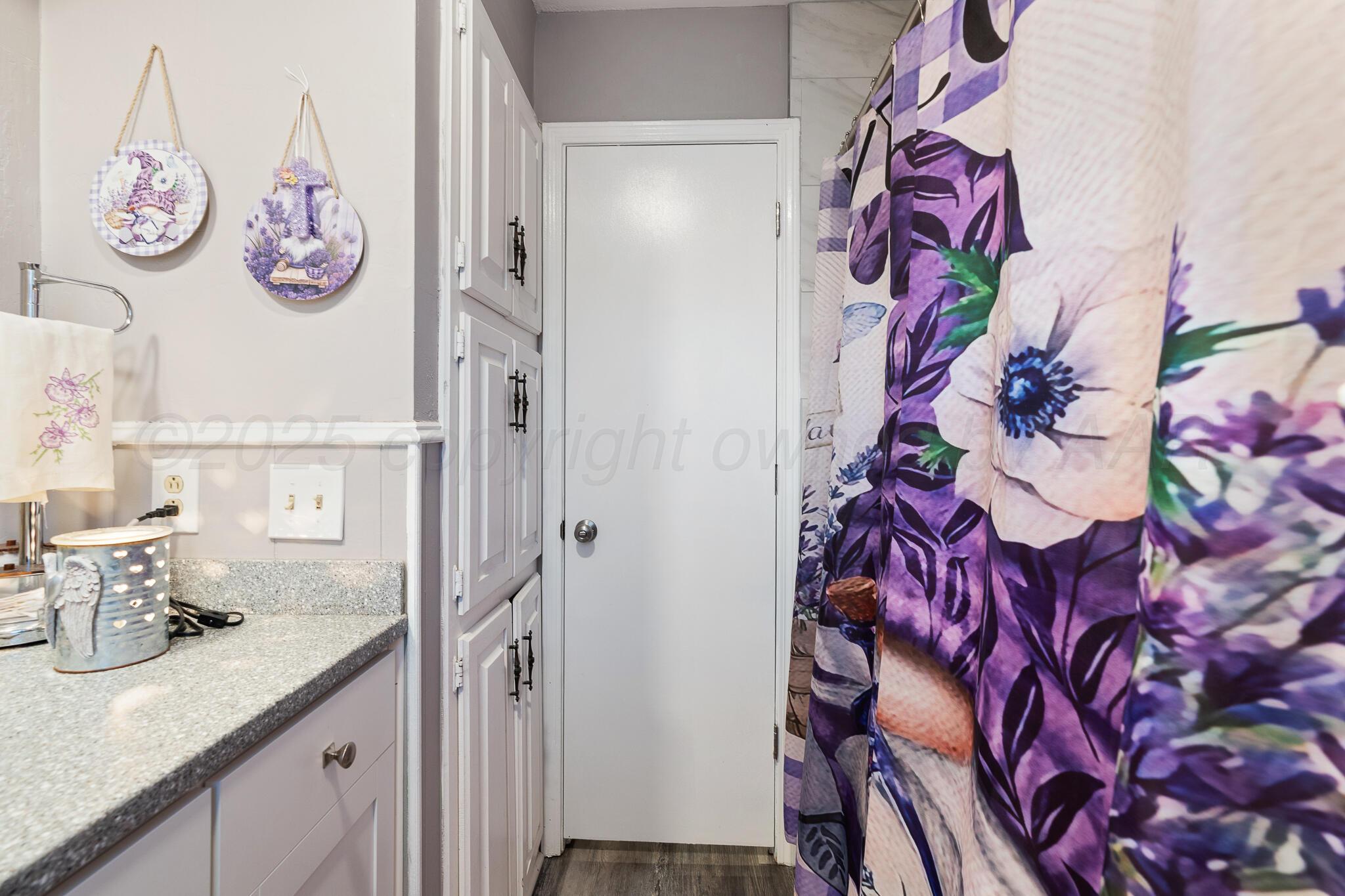 4307 Harmony Street Amarillo, TX 79109 - Photo 24 of 25 a bathroom with a sink and a mirror