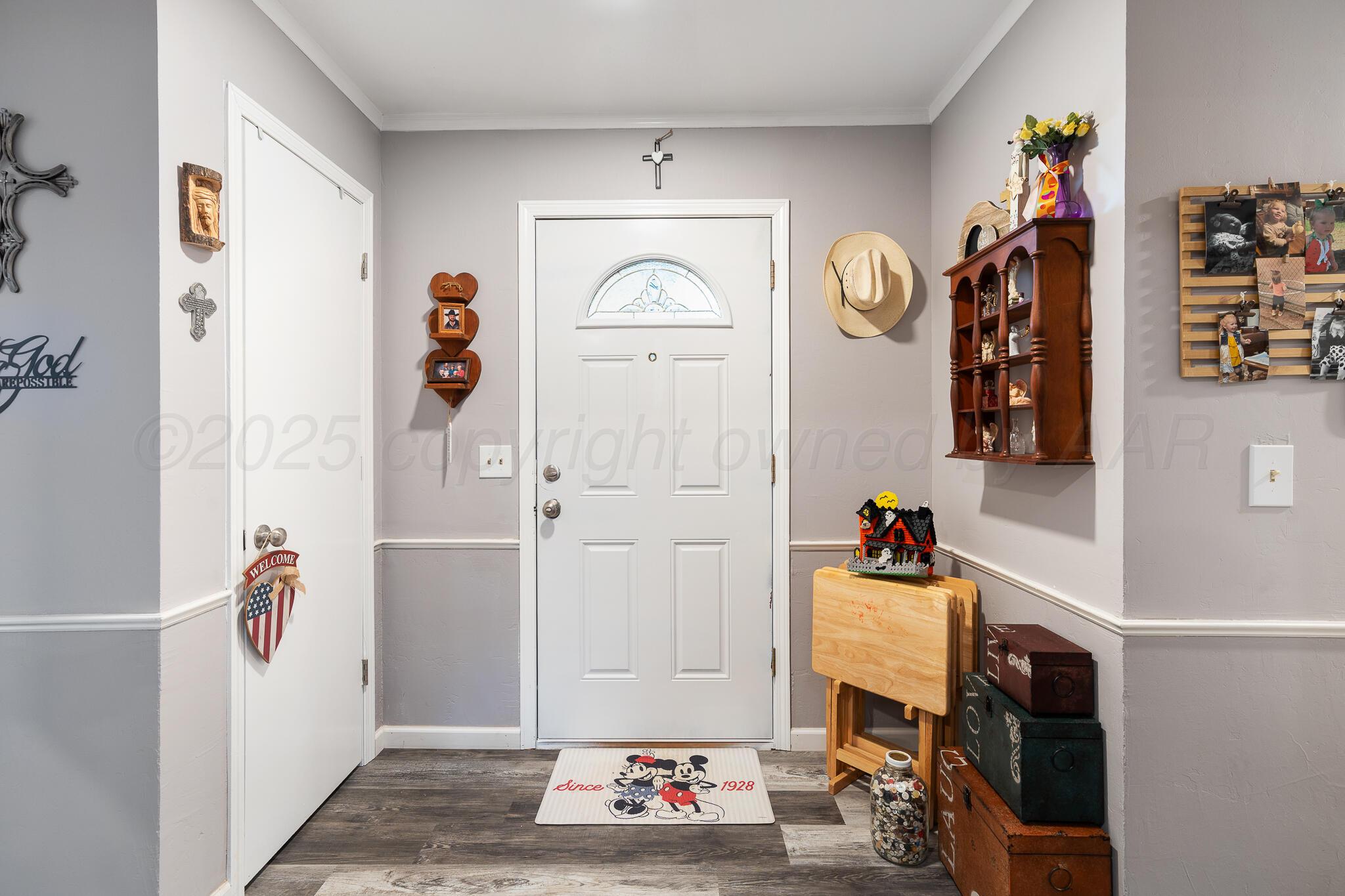 4307 Harmony Street Amarillo, TX 79109 - Photo 4 of 25 a living room with baby toys and dresser with wooden floor