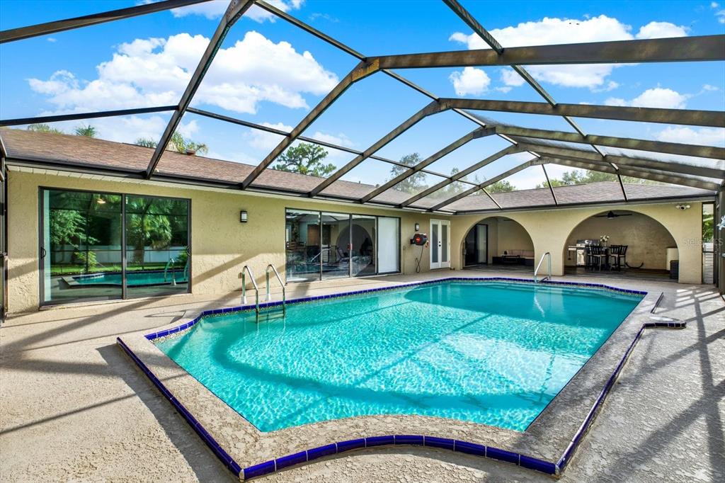 7487 River Country Drive Weeki Wachee, FL 34607 - Photo 45 of 53 a view of a patio with a table and chairs