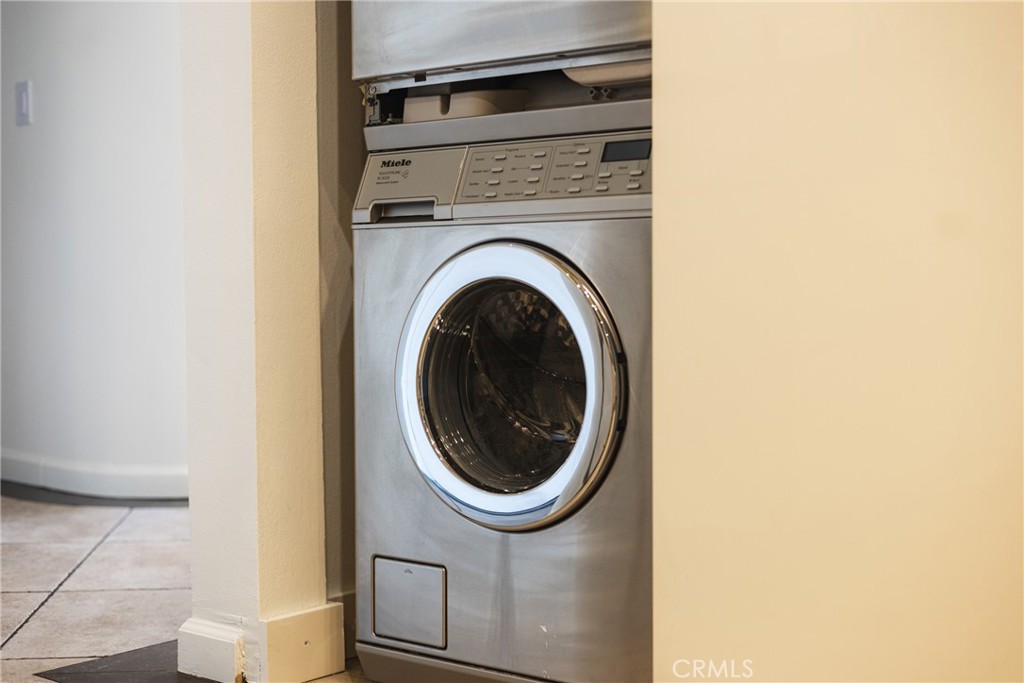 4557 Haskell Avenue, Unit 301 Encino, CA 91436 - Photo 13 of 40 a utility room with dryer and washer