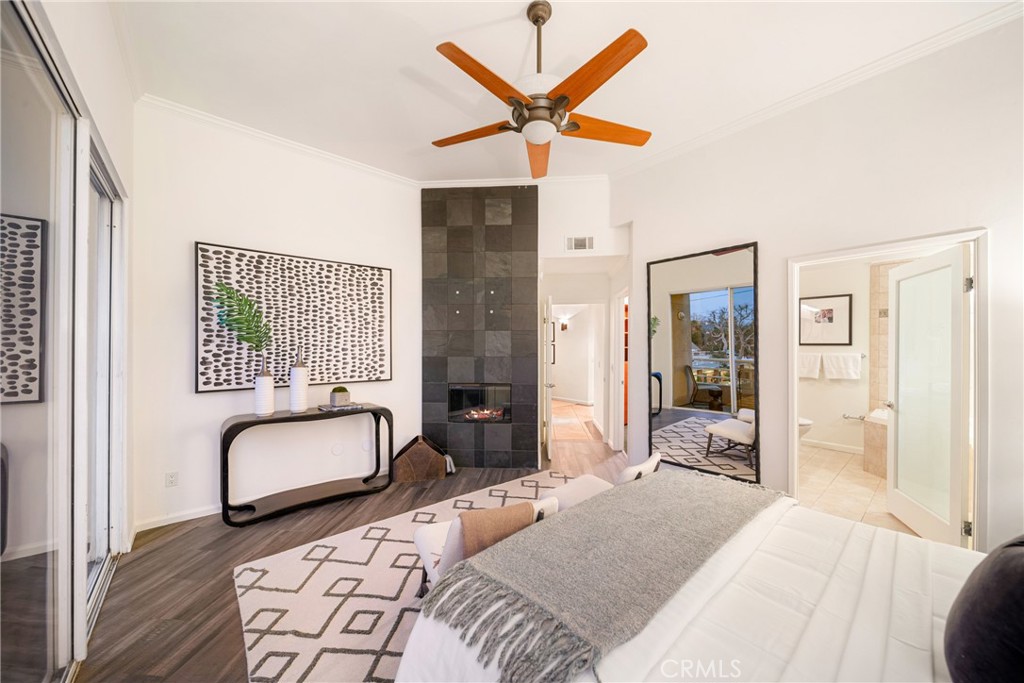 4557 Haskell Avenue, Unit 301 Encino, CA 91436 - Photo 18 of 40 a bedroom with a bed and a large window