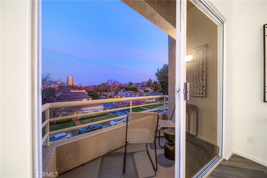 4557 Haskell Avenue, Unit 301 Encino, CA 91436 - Photo 19 of 40 a view of a balcony and chairs