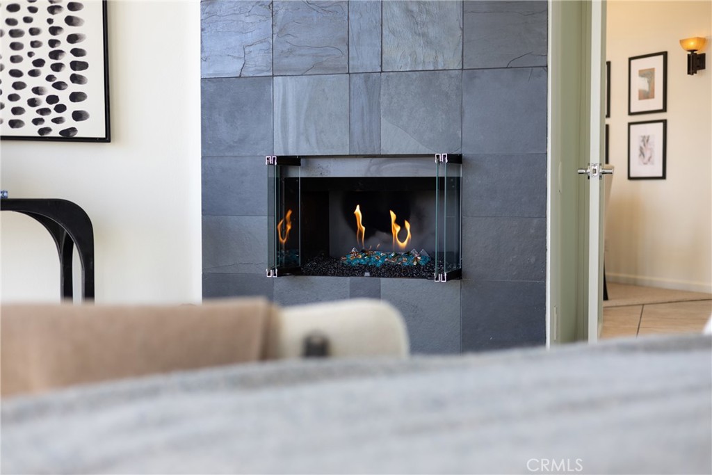 4557 Haskell Avenue, Unit 301 Encino, CA 91436 - Photo 23 of 40 a living room with furniture and a fireplace