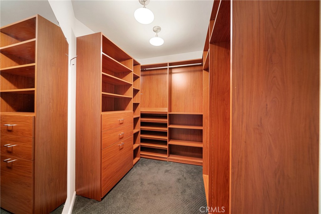 4557 Haskell Avenue, Unit 301 Encino, CA 91436 - Photo 24 of 40 a view of walk in closet with empty racks