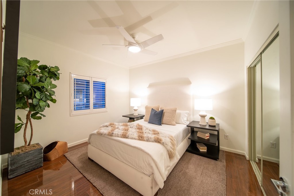 4557 Haskell Avenue, Unit 301 Encino, CA 91436 - Photo 29 of 40 a bedroom with a bed and a potted plant