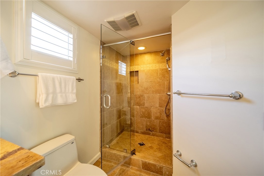 4557 Haskell Avenue, Unit 301 Encino, CA 91436 - Photo 32 of 40 a bathroom with a shower and toilet