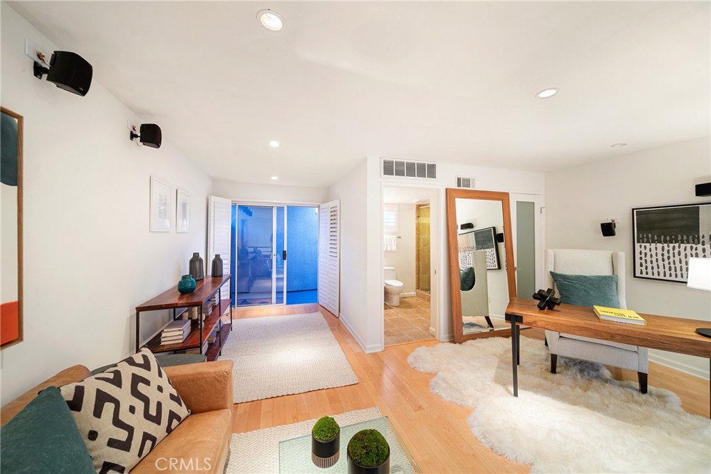 4557 Haskell Avenue, Unit 301 Encino, CA 91436 - Photo 36 of 40 a bedroom with furniture and a rug