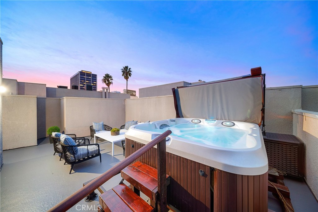 4557 Haskell Avenue, Unit 301 Encino, CA 91436 - Photo 39 of 40 a room with furniture and a table