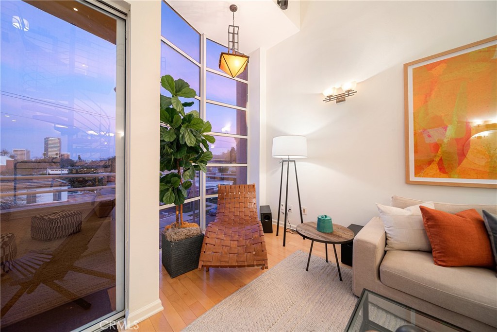 4557 Haskell Avenue, Unit 301 Encino, CA 91436 - Photo 5 of 40 a living room with furniture and a potted plant