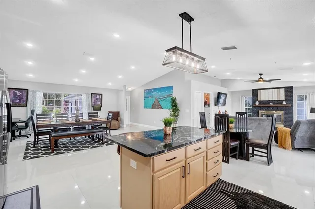 a kitchen with stainless steel appliances granite countertop a stove and a sink