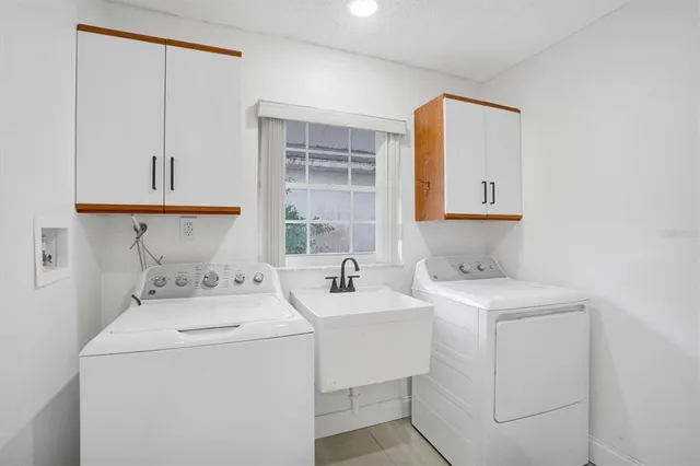 a view of bathroom with dual sinks