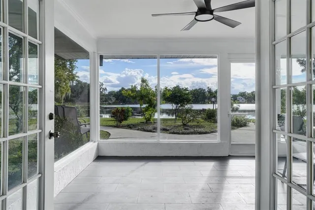 a view of a living room and a floor to ceiling window