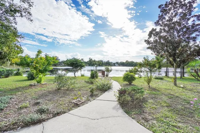 a view of a lake with a big yard