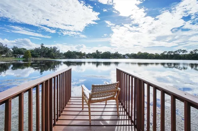 a view of wooden deck with lake view
