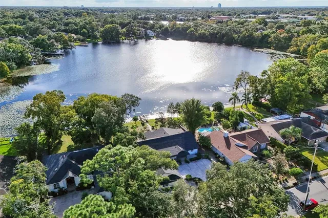 an aerial view of a house with a lake view
