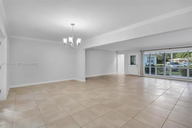 a view of a livingroom with a ceiling fan and window