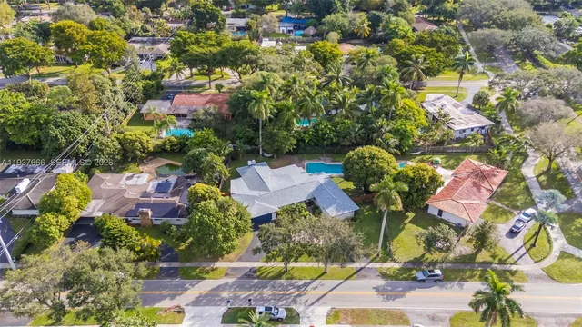 a view of a house that has a tree
