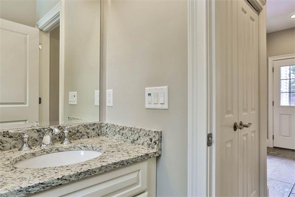 7 Davis Road Bedford, MA 01730 - Photo 14 of 30 a bathroom with a granite countertop sink and a mirror