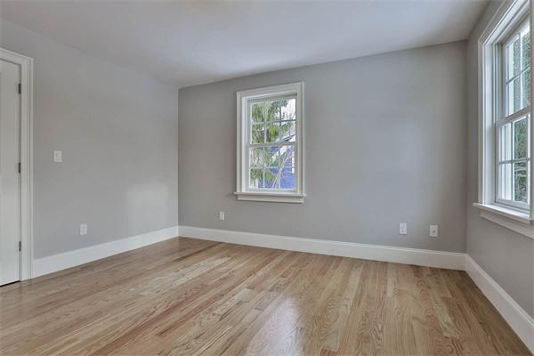 7 Davis Road Bedford, MA 01730 - Photo 25 of 30 a view of an empty room with wooden floor and a window