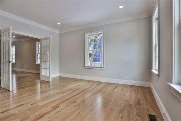 7 Davis Road Bedford, MA 01730 - Photo 4 of 30 an empty room with wooden floor and windows