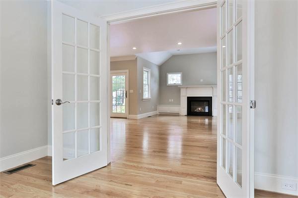 7 Davis Road Bedford, MA 01730 - Photo 5 of 30 a view of livingroom with hardwood floor and a ceiling fan
