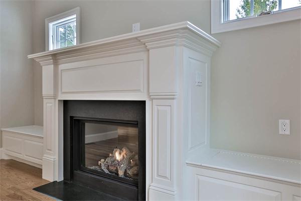 7 Davis Road Bedford, MA 01730 - Photo 7 of 30 a view of a fireplace with a hallway