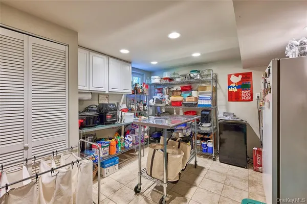 a kitchen with stainless steel appliances granite countertop a refrigerator sink and cabinets