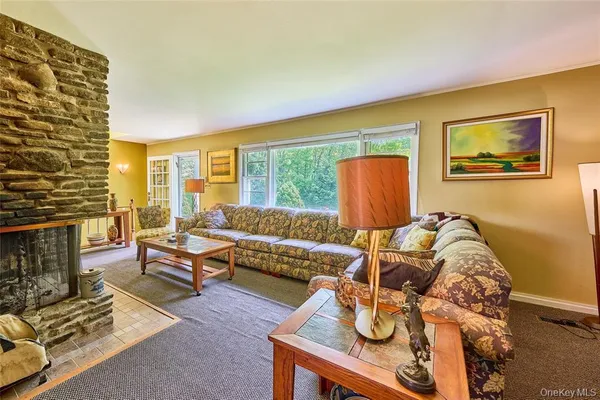 a living room with furniture and a rug