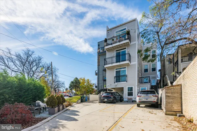 a view of a brick building with many windows