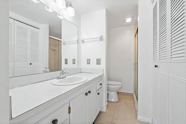 a bathroom with a glass shower door