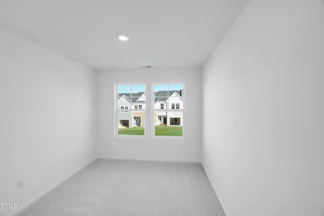 a view of storage and utility room with window