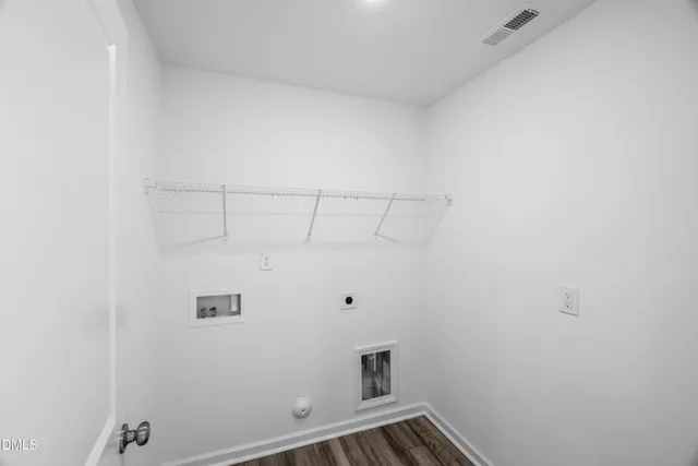 a view of hallway with stainless steel appliances