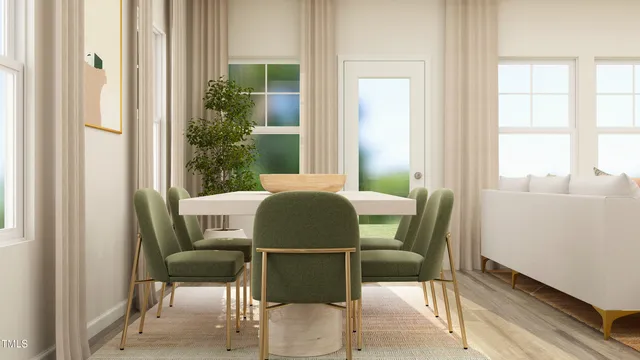 a kitchen with stainless steel appliances white cabinets and wooden floor