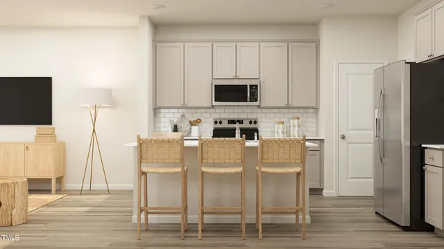 a dining room with furniture and wooden floor