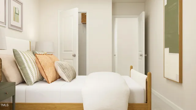 a bedroom with bed and a painting on the wall