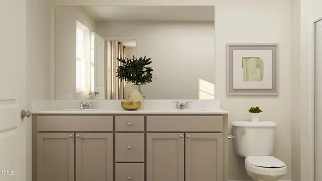 a bathroom with a granite countertop sink a toilet and shower