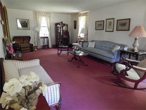 5 Wamsutta Road Scituate, MA 02066 - Photo 2 of 10 a living room with furniture and a fireplace