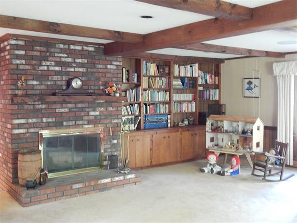 5 Wamsutta Road Scituate, MA 02066 - Photo 5 of 10 a room with storage and a fireplace