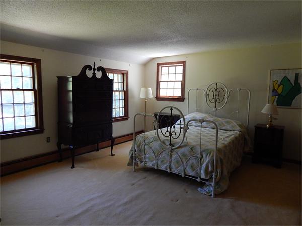 5 Wamsutta Road Scituate, MA 02066 - Photo 7 of 10 a bedroom with bed and a window