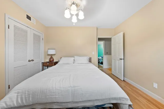 a large white bed in a white room